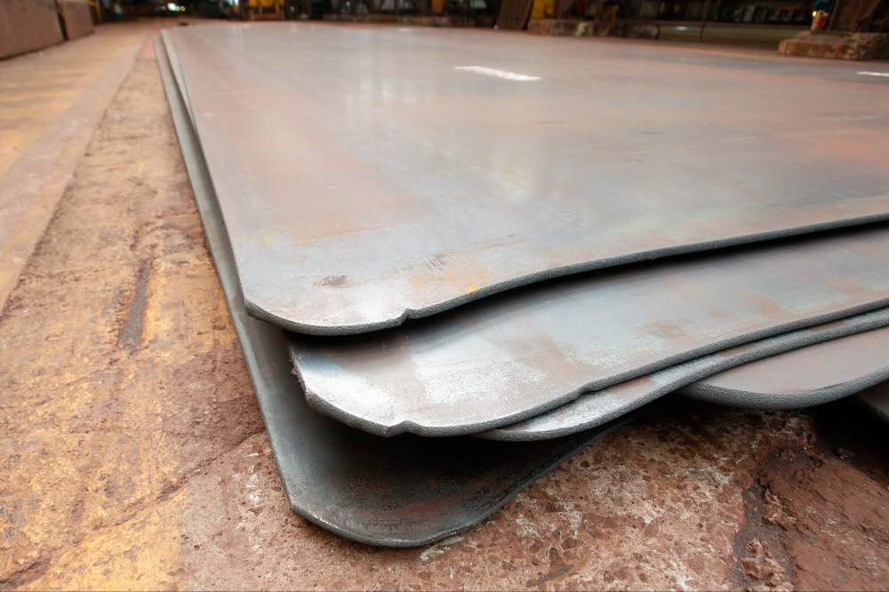 The rounded corners of the steel plate is trimmed square and the remnants find their way back to the BOS steelmaking plant.