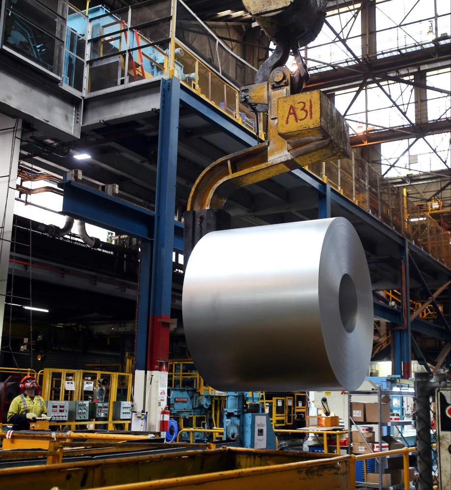 A crane carries a freshly-coated steel coil onto the last stage in its Port Kembla journey.