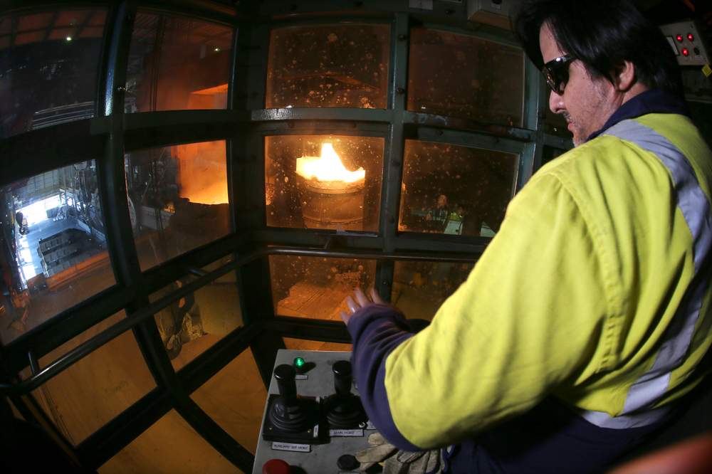 Crane driver Patricio Ceron delivering ingredients for steelmaking into the BOS vessel. 