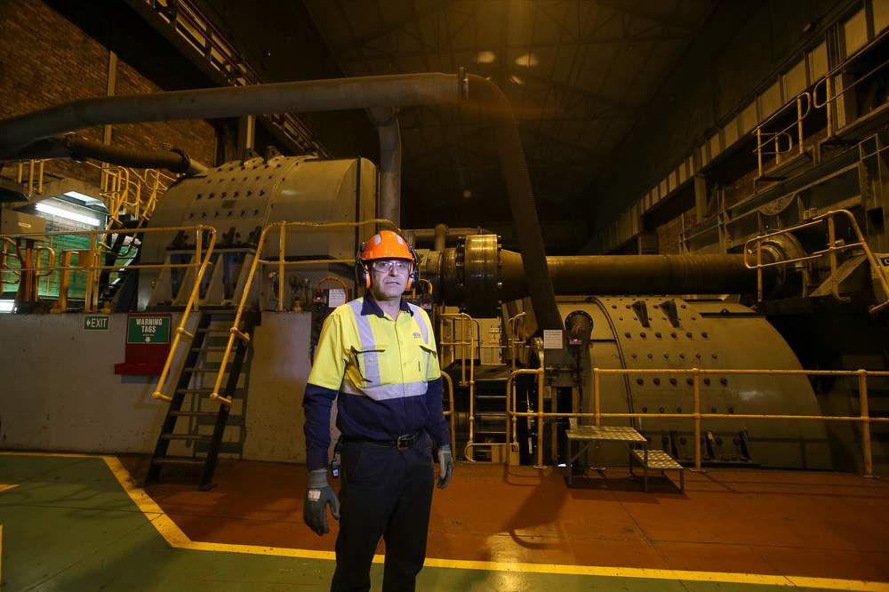 Hot strip mill operations manager Milco Stojanoski in front of the giant motors that power the rollers which will flatten and stretch the hot steel slab.