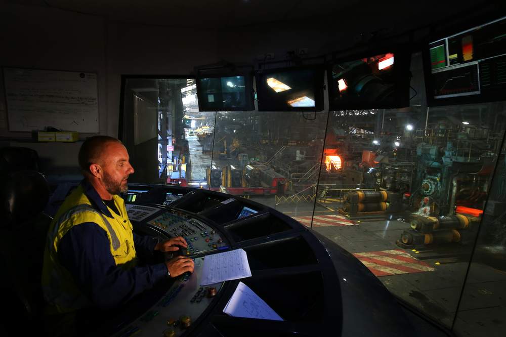 Hot strip mill finishing operator Darren Smith oversees the machines that change a steel slab to a long thin strip of metal.