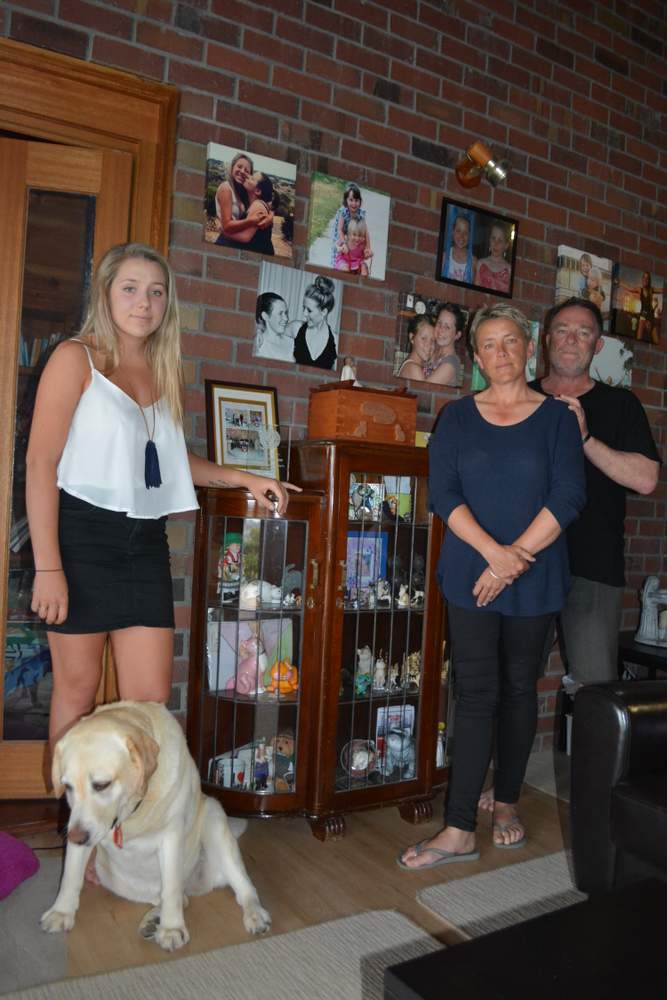 MEMORIES: Katelin, Karen and Noel Kneebone in their family home.
