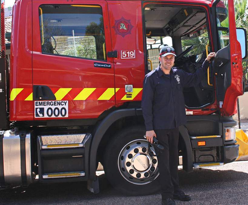 MFS: Former Port Augusta MFS Senior Officer Greg Bailey in front of a Port Augusta MFS Road Crash Rescue Appliance. 